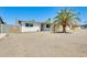 Bright and sunny front exterior of this single Gathering home with desert landscaping and a well-manicured yard at 3306 W Lupine Ave, Phoenix, AZ 85029