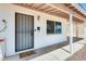 Inviting front porch featuring security door, painted brick and a neutral colored welcome mat at 3306 W Lupine Ave, Phoenix, AZ 85029