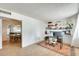 Well-lit office space with tile floors, built-in shelves, and a view of the dining and living room at 3306 W Lupine Ave, Phoenix, AZ 85029