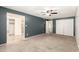 Bedroom featuring a walk in closet and bath, ample closet space, and neutral carpet at 3732 E Greenway Ln, Phoenix, AZ 85032