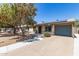 Charming single-story home featuring a well-maintained front yard and a convenient attached garage at 3732 E Greenway Ln, Phoenix, AZ 85032