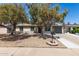 Charming home featuring mature trees and low-maintenance desert landscaping at 3732 E Greenway Ln, Phoenix, AZ 85032