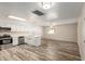 Updated kitchen featuring stainless steel appliances, white cabinets and a center island with sink at 3732 E Greenway Ln, Phoenix, AZ 85032