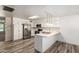 Bright kitchen boasts stainless steel appliances, island and white cabinets at 3732 E Greenway Ln, Phoenix, AZ 85032