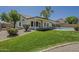 Backyard features lush lawn, a covered patio, and a private pool, perfect for outdoor living at 3802 W Sheffield Ave, Chandler, AZ 85226