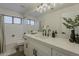 Stylish bathroom featuring a large mirror, under-mount sink, and a shower-tub combo at 3802 W Sheffield Ave, Chandler, AZ 85226