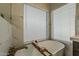 A freestanding white bathtub offers a tranquil retreat, perfect for relaxation and unwinding at 3802 W Sheffield Ave, Chandler, AZ 85226