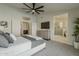 Spacious bedroom with an ensuite bathroom and access to an additional room through white double doors at 3802 W Sheffield Ave, Chandler, AZ 85226
