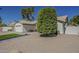 Beautiful single-story home with desert landscaping, manicured trees, and a two-car garage at 3802 W Sheffield Ave, Chandler, AZ 85226