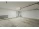 Spacious two car garage with concrete floors and updated lighting, perfect for storage and parking at 3802 W Sheffield Ave, Chandler, AZ 85226