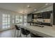 Spacious kitchen with modern appliances, dark cabinets, large island and access to outdoor living at 3802 W Sheffield Ave, Chandler, AZ 85226