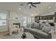 Inviting living room with fireplace, comfortable seating, and a seamless flow to the modern kitchen at 3802 W Sheffield Ave, Chandler, AZ 85226