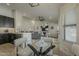 Living room with dark cabinets, open floor plan with comfortable seating and natural light at 3802 W Sheffield Ave, Chandler, AZ 85226