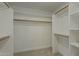 Spacious walk-in closet with ample shelving and wooden rods for organization at 3802 W Sheffield Ave, Chandler, AZ 85226