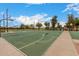 Spacious community basketball court with green playing surface, ideal for sports and recreation in the neighborhood at 41227 W Granada Dr, Maricopa, AZ 85138