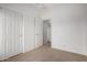 Neutrally decorated bedroom showcasing its great closet space at 41227 W Granada Dr, Maricopa, AZ 85138