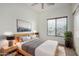 Inviting bedroom with a cozy bed, ample natural light, and stylish decor at 41227 W Granada Dr, Maricopa, AZ 85138