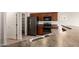 Cozy kitchen featuring stainless steel appliances, cabinetry, and a breakfast bar at 41227 W Granada Dr, Maricopa, AZ 85138