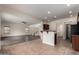 Open-concept layout with living room, kitchen bar, and easy access to other rooms at 41227 W Granada Dr, Maricopa, AZ 85138