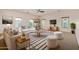 Spacious living room featuring neutral tones, bright lighting, and contemporary furnishings at 41227 W Granada Dr, Maricopa, AZ 85138