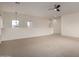 An open loft space with carpet flooring, ideal for a secondary living room at 41227 W Granada Dr, Maricopa, AZ 85138