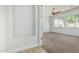Clean bedroom with a ceiling fan, new carpet, and natural light at 4718 E Decatur St, Mesa, AZ 85205