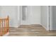 Bright foyer featuring wood flooring, white trim, neutral paint, and contemporary lighting at 4718 E Decatur St, Mesa, AZ 85205
