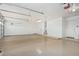 Spacious garage with epoxy flooring, high ceilings, and plenty of room for vehicles and storage at 4718 E Decatur St, Mesa, AZ 85205