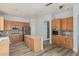Bright kitchen features stainless steel appliances and an island at 4718 E Decatur St, Mesa, AZ 85205