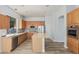 Well-lit kitchen with stainless steel appliances, island, and unique backsplash at 4718 E Decatur St, Mesa, AZ 85205