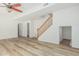 Bright living room with wood-look floors and a staircase offering a modern, open layout at 4718 E Decatur St, Mesa, AZ 85205