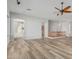 Spacious living room with new floors, ceiling fan, and natural light at 4718 E Decatur St, Mesa, AZ 85205