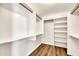 Well-organized walk-in closet features custom shelving and ample storage space, complemented by durable wood-look flooring at 4811 W Oakland St, Chandler, AZ 85226