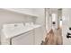 Bright laundry room features modern appliances and convenient overhead shelving, with easy access to the rest of the home at 4811 W Oakland St, Chandler, AZ 85226