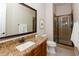 This bathroom boasts a granite vanity, shower, and toilet at 5208 S Gold Leaf Pl, Chandler, AZ 85249