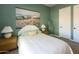 Comfortable bedroom featuring serene artwork and matching nightstands at 5208 S Gold Leaf Pl, Chandler, AZ 85249