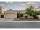 Charming single-story home with a well-manicured front yard and a two-car garage at 5208 S Gold Leaf Pl, Chandler, AZ 85249