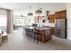 Bright open kitchen offers a central island with seating, flowing seamlessly into adjacent living areas at 5208 S Gold Leaf Pl, Chandler, AZ 85249