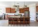 Spacious kitchen boasts an island with barstool seating and modern stainless steel appliances at 5208 S Gold Leaf Pl, Chandler, AZ 85249