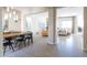 Open-concept dining room, living room, and hallway offer a welcoming and airy feel at 5208 S Gold Leaf Pl, Chandler, AZ 85249
