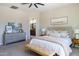 Light and airy main bedroom with a soft color palette and comfortable furnishings at 5208 S Gold Leaf Pl, Chandler, AZ 85249