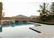 Sparkling swimming pool with desert landscaping, perfect for enjoying the Arizona sunshine at 5208 S Gold Leaf Pl, Chandler, AZ 85249