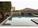 Inviting pool featuring desert landscaping with stone accents for a serene backyard escape at 5208 S Gold Leaf Pl, Chandler, AZ 85249