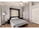 Cozy bedroom boasts hardwood floors and a built in Murphy bed at 5215 W Del Rio St, Chandler, AZ 85226