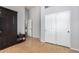 Cozy room showing closet doors, wood look floors, and an inviting open doorway at 5215 W Del Rio St, Chandler, AZ 85226