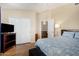 Relaxing bedroom showcasing closet, natural light, and neutral wall color at 5215 W Del Rio St, Chandler, AZ 85226