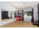 Open concept bonus room featuring a full-length mirror and lots of natural light at 5215 W Del Rio St, Chandler, AZ 85226