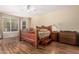 Comfortable bedroom featuring wood frame bed, ceiling fan, and natural light at 5215 W Del Rio St, Chandler, AZ 85226