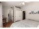 Stylish bedroom boasts wood floors, ceiling fan, double closets and en suite bathroom at 5215 W Del Rio St, Chandler, AZ 85226