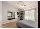 Inviting bonus room features a versatile Murphy bed, hardwood floors, and a large mirror at 5215 W Del Rio St, Chandler, AZ 85226